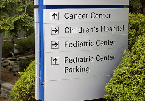 Hospital sign with directions to facilities.