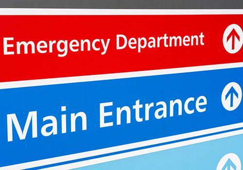 Signs directing patients to the departments of a British hospital.