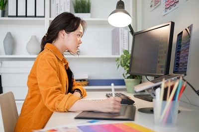 Female graphic designer analyzing color samples for project