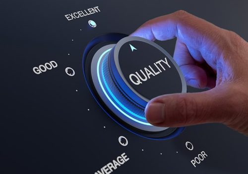 Selecting excellent quality to increase customer satisfaction. Quality assurance management and control for products or services. Concept with QA manager's hand turning knob.